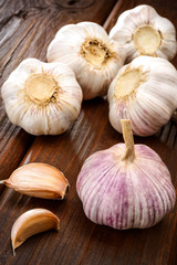 garlic and a whole wooden table closeup