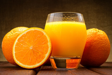 glass of Orange juice and oranges