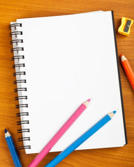 Notepad with kids stationery on a table