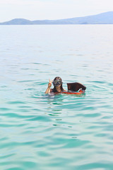 A woman swimming snorkeling in the sea