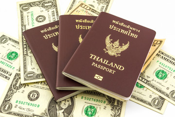 Thailand passport on U.S. Currency bank note.