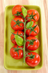 Cherry tomatoes on wooden background