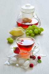 Ice tea with berries and cubes of ice