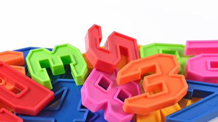 Colorful plastic numbers on white
