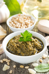 pesto sauce in a bowl, top view