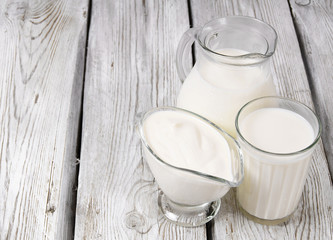 Dairy products on wooden background.
