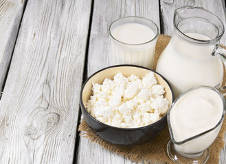 Dairy products on wooden background.