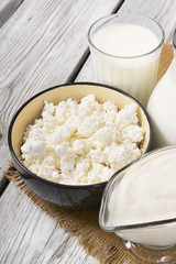 Dairy products on wooden background.