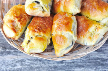 Freshly baked pies with a poppy-seed on old wooden table
