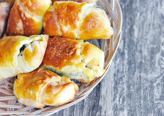 Freshly baked pies with a poppy-seed on old wooden table