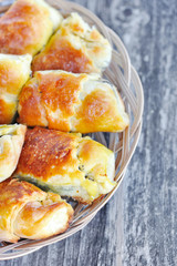 Freshly baked pies with a poppy-seed on old wooden table