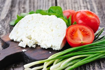 Cheese with tomatoes and arugula and onion