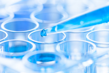 pipette and test tube in a laboratory