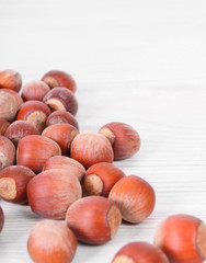 Nuts on wooden board.