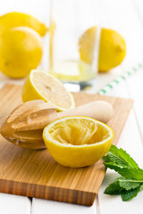 squeezed lemon fruit and citrus reamer