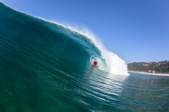 Surfing Body-boarder Rides Inside Hollow Blue Wave
