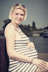 Fototapeta premium Pretty pregnant woman in sailor style
