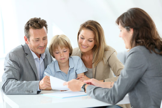 Family meeting real-estate agent to buy new home