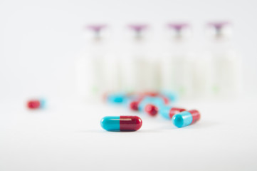 Red and Blue capsule on medicine background
