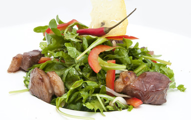 duck with arugula on a white background in the restaurant