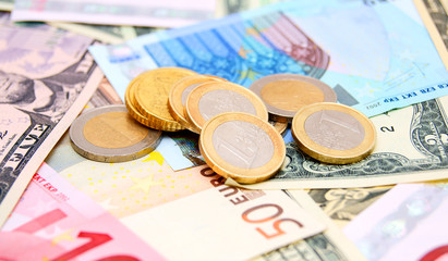 Coins against from banknotes