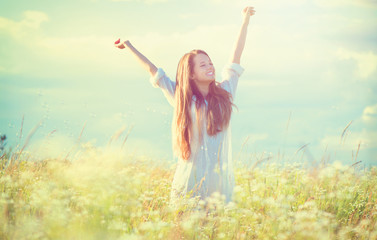 Beauty girl outdoors enjoying nature