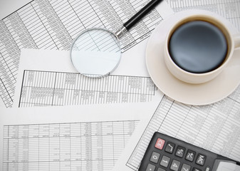 Coffee, the calculator and magnifier