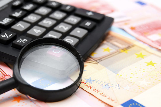 Magnifier and the calculator for euro banknotes.