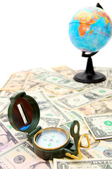 Compass and the globe on dollars.