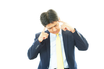 頭痛を訴えるビジネスマン