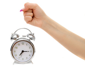 Alarm clocks and female fist. On a white background.
