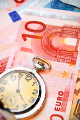 Watch and banknote euro.
