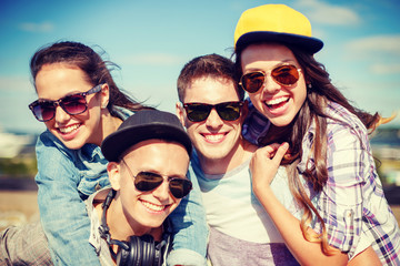 group of smiling teenagers hanging out