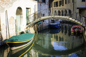 Ancient buildings in the channel in Venice.