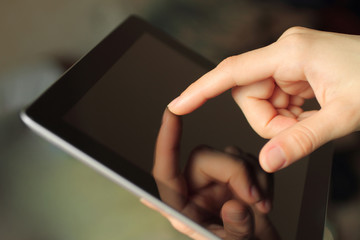 Hand toching smart phone on nature background .