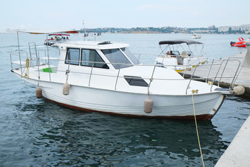Fototapeta premium motor boat stand at a berth