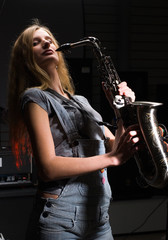 Attractive woman with saxophone