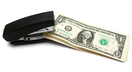 Stapler and money. On a white background.