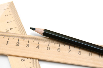 Pencil and rulers on a white background.