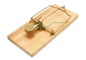 Mousetrap with gold coins. On a white background.