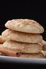Stacked Snickerdoodle cookies isolated on a black background