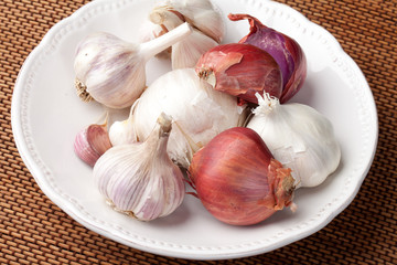 Platter of California grown organic garlic assortment - Music Garlic, Spanish Roja Garlic, Russian Red Garlic, Elephant Garlic, California White Garlic, and French Red Shallots