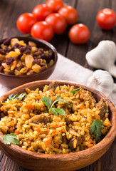 Wooden bowl of pilaf