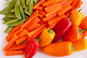 Vegetable platter with snap peas carrots and mini peppers