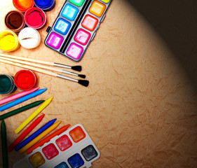 School tools on rumpled paper.