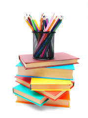 Fototapeta premium Multi-coloured books and basket with pencils.