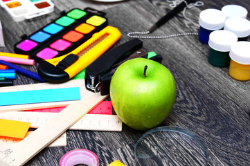 Back to school. On wooden background.