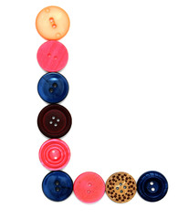 The alphabet from buttons for sewing.