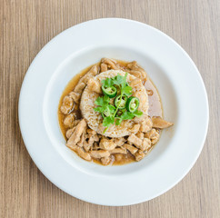 Chicken with brown sauce on rice