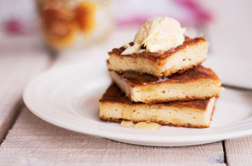 pieces casseroles on a round plate and a cream, honey
